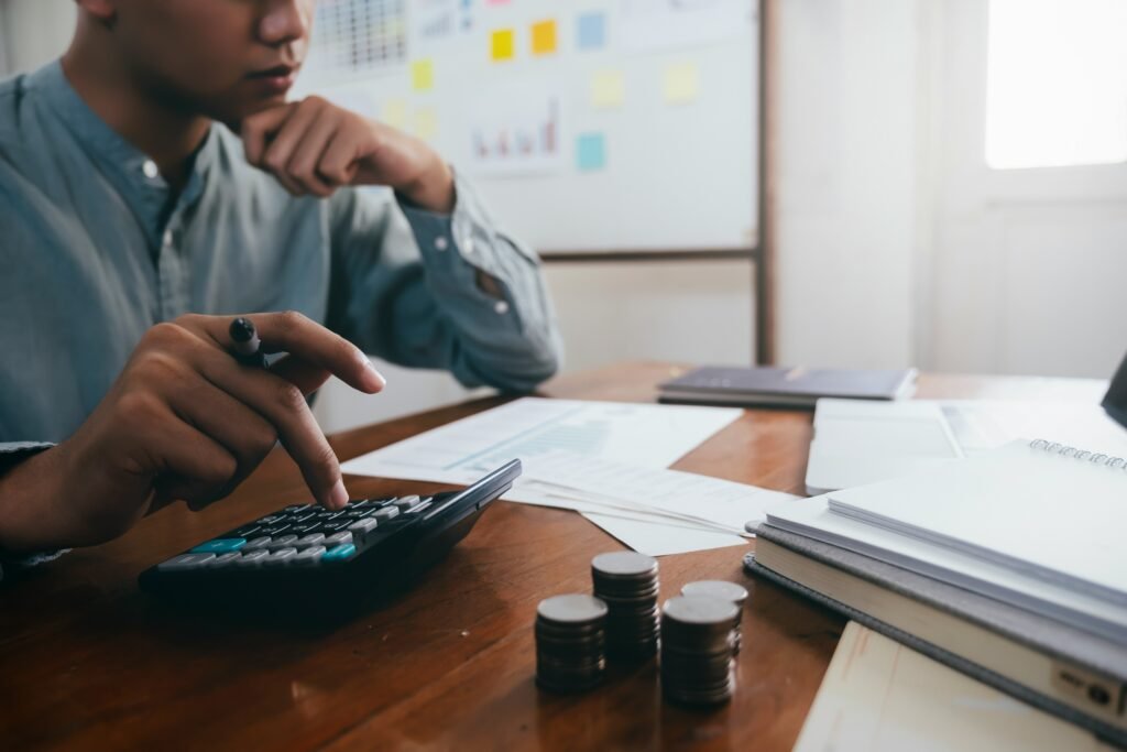 Man calculating credit card interest