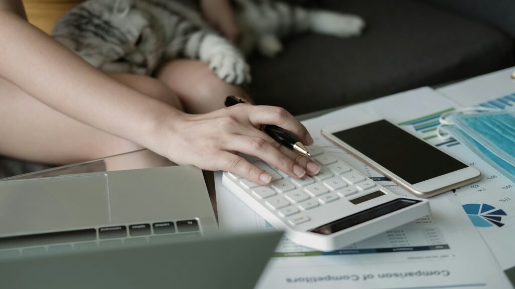Woman calculating credit card interest