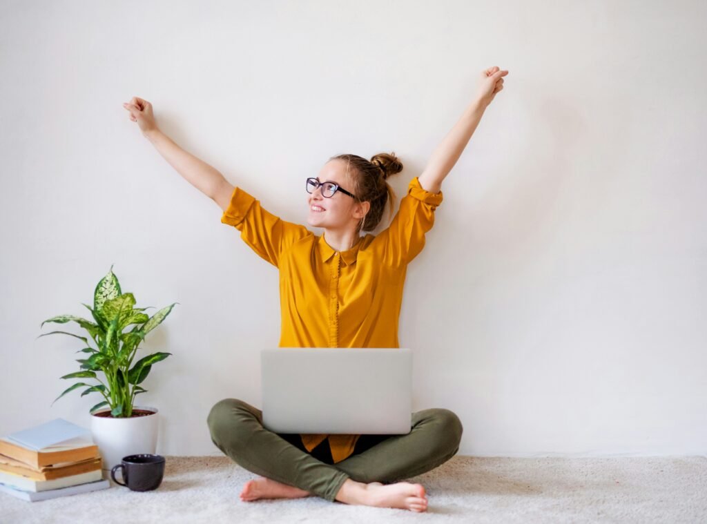 Woman on laptop saying yes