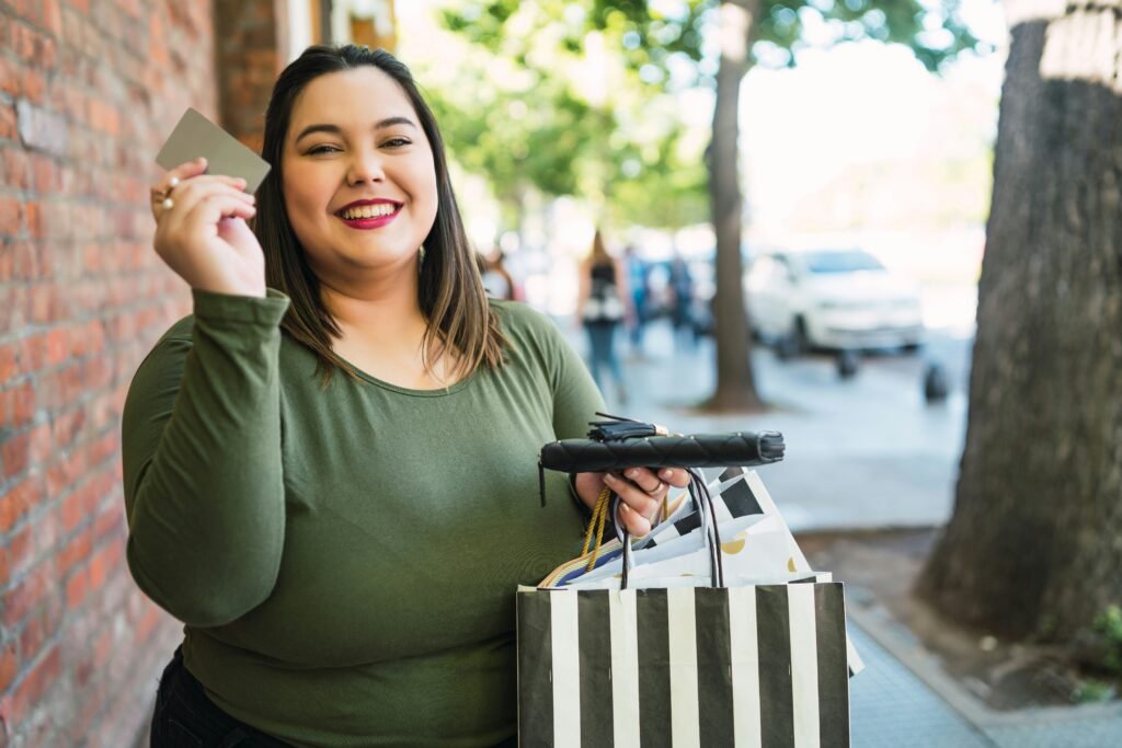 Woman with a happy look and credit card