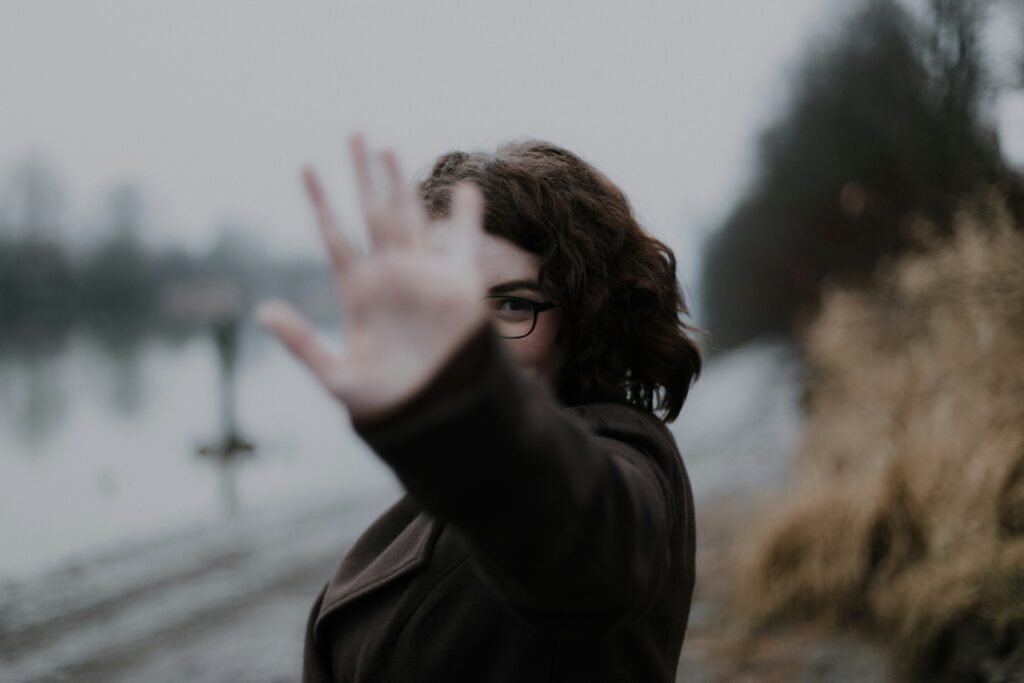 Woman with her hand out saying no to balance transfer