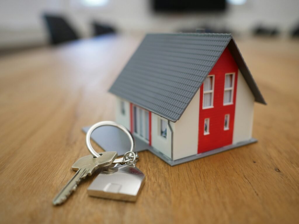 Small house image with keys next to it