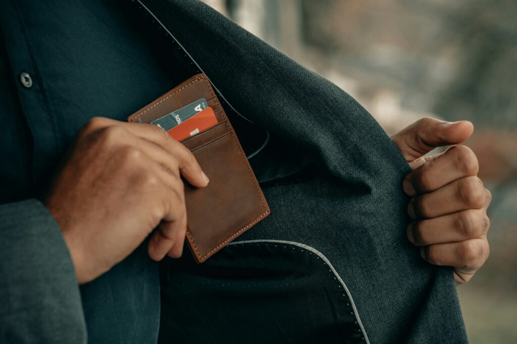 Man putting away wallet